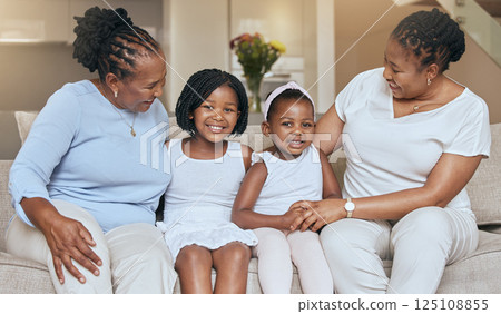 Black family on sofa, children smile with grandmother in living room and portrait in Chicago home. Happy mom loves young kids, relax together on couch with girl and elderly woman support on weekend Black family on sofa, children smile with grandmother in living room and portrait in Chicago home. Happy mom loves young kids, relax together on couch with girl and elderly woman support on weekend 125108855