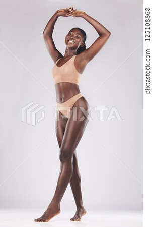 Glow, skincare and black woman with underwear for beauty, fashion and lifestyle against a white studio background. Self love, confidence and happy African model with empowerment with lingerie Glow, skincare and black woman with underwear for beauty, fashion and lifestyle against a white studio background. Self love, confidence and happy African model with empowerment with lingerie 125108868
