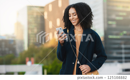Black woman, phone text and city travel of a person on a mobile on 5g internet and web with a smile. Mobile phone texting or social media app scroll of a urban happy female with technology online Black woman, phone text and city travel of a person on a mobile on 5g internet and web with a smile. Mobile phone texting or social media app scroll of a urban happy female with technology online 125108882