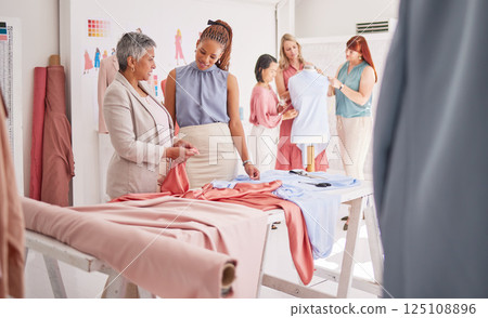 Fashion, team and design planning, teamwork and support with material, creative and collaboration in a workshop. Cloth, fabric and texture in designer small business with group working in a studio 125108896