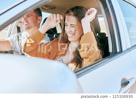 Couple, road trip and smile in car together in traffic for drive, transport or driving adventure. Man, woman and happy on road, street or journey with happiness on travel, holiday or vacation in sun 125108930