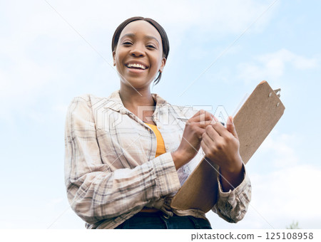 Farm, portrait and woman farmer with a checklist on a clipboard to monitor the growth of produce. Sustainable, agriculture and agro African girl working in a eco friendly environment on a field. 125108958