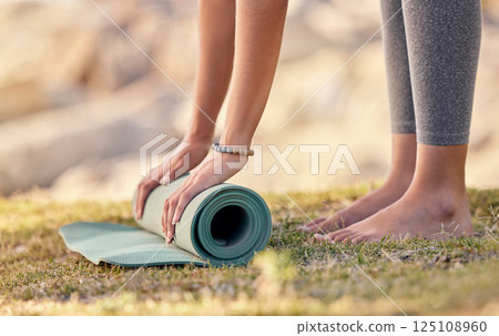 Yoga mat, pilates start and nature of a woman doing fitness, chakra exercise and wellness training. Peace meditation, spiritual zen and hand roll a balance mat for meditate and holistic workout Yoga mat, pilates start and nature of a woman doing fitness, chakra exercise and wellness training. Peace meditation, spiritual zen and hand roll a balance mat for meditate and holistic workout 125108960