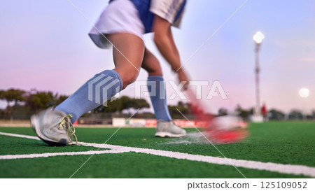 Sports, hockey and hit with woman on field for training, fitness and goals exercise. Challenge, action or power with shoes of hockey player in stadium for competition, performance and athlete workout Sports, hockey and hit with woman on field for training, fitness and goals exercise. Challenge, action or power with shoes of hockey player in stadium for competition, performance and athlete workout 125109052