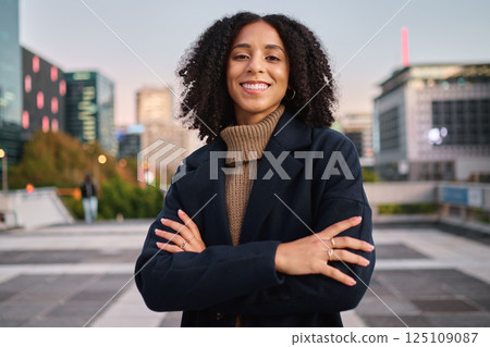 Black woman, portrait smile and arms crossed in the city for vision, ambition or career success. Confident and happy African American female smiling for business, travel or freedom in a urban town 125109087