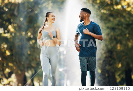 Diversity, running and couple wellness conversation in park for training exercise and sports marathon motivation. Interracial runner athletes, cardio workout and healthy fitness together in forest 125109110