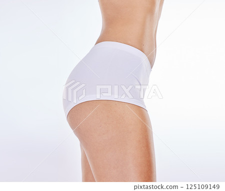 Buttocks, underwear and body with a model woman in studio on a gray background to promote weightloss or diet. Fitness, skin and panties with a female posing for wellness, losing weight or lifestyle 125109149