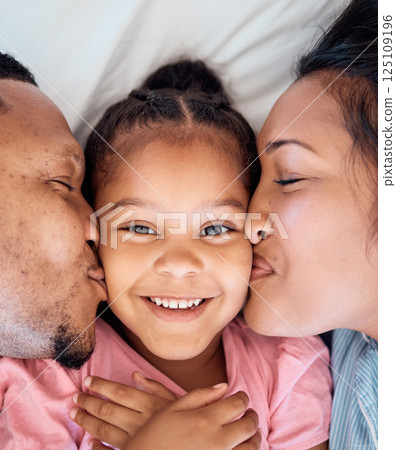 Parents kiss, daughter and smile portrait of a black family together with love, bonding and care. Home, happiness and youth of a kid, mother and father top view cheek kissing a face on a bedroom bed Parents kiss, daughter and smile portrait of a black family together with love, bonding and care. Home, happiness and youth of a kid, mother and father top view cheek kissing a face on a bedroom bed 125109196