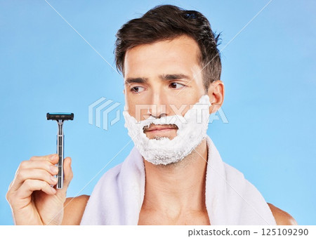 Man doubt, shave and face in studio with razor, thinking or cosmetics for self care, beauty and foam. Grooming, facial health and skincare with shaving cream, beard and contemplating in bathroom Man doubt, shave and face in studio with razor, thinking or cosmetics for self care, beauty and foam. Grooming, facial health and skincare with shaving cream, beard and contemplating in bathroom 125109290