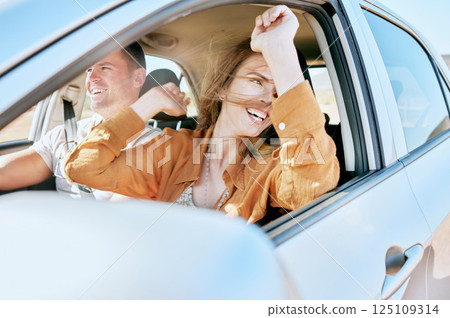 Road trip, travel and couple in a car in nature for freedom, vacation and happiness together. Summer, happy and man with an excited woman with smile on a drive in the countryside with transport Road trip, travel and couple in a car in nature for freedom, vacation and happiness together. Summer, happy and man with an excited woman with smile on a drive in the countryside with transport 125109314