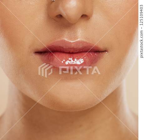 Lips, skincare and woman with lipstick for cosmetics, gloss and wellness for clear, smooth and glow skin. Natural beauty, healthy and girl or female with makeup for shiny mouth, fresh and collagen. Lips, skincare and woman with lipstick for cosmetics, gloss and wellness for clear, smooth and glow skin. Natural beauty, healthy and girl or female with makeup for shiny mouth, fresh and collagen. 125109403