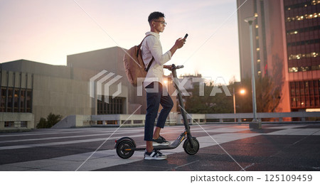 Creative student, electric scooter or man with phone is city, street or building at night networking, 5g network or social media. Travel, designer or male with smartphone for contact us or media app Creative student, electric scooter or man with phone is city, street or building at night networking, 5g network or social media. Travel, designer or male with smartphone for contact us or media app 125109459