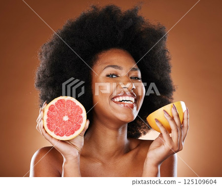Skincare, beauty and portrait of black woman with grapefruit for vitamin c, skin glow or natural facial routine. Food product, self care and face of nutritionist model with organic detox treatment 125109604