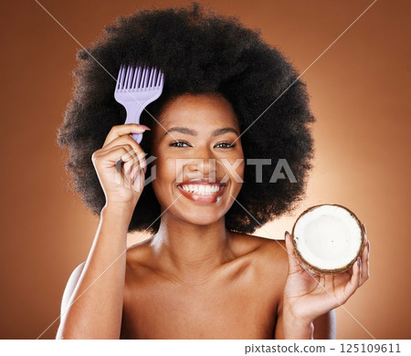 Hair care, comb and portrait girl with coconut for afro hair growth, healthy hair hydration or moisturizing hairstyle treatment. Fruit product, wellness and face of black woman with natural routine 125109611