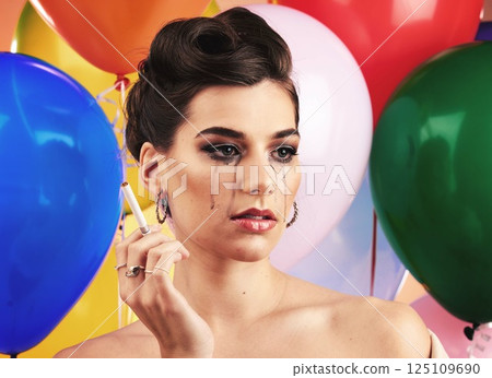 Party balloon and makeup woman crying with sad, depressed and disappointed tears on face. Thinking, depression and mental health problem of girl at event smoking cigarette with sadness. 125109690
