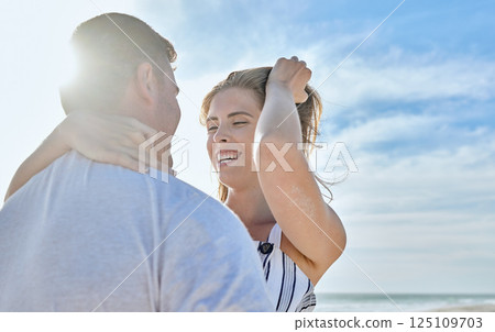 Couple, love and beach vacation with a hug, love and happiness together on a summer blue sky travel destination. Smile, support and care of a man and woman in healthy marriage on Bali holiday 125109703