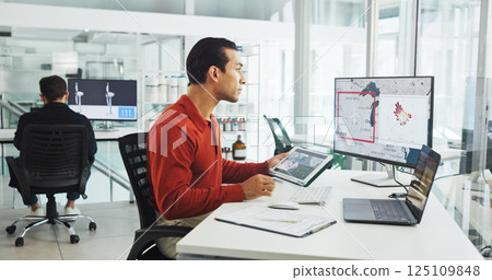 Computer screen, tablet and windmill with business man in office for renewable energy or sustainability. Ecology, electricity and wind turbine with map on display for development or engineering Computer screen, tablet and windmill with business man in office for renewable energy or sustainability. Ecology, electricity and wind turbine with map on display for development or engineering 125109848