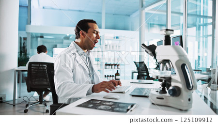 Laptop, science and yawn with man in laboratory for healthcare, medical or pharmaceutical innovation. Computer, fatigue and microscope with tired scientist in clinical trial for development or study 125109912