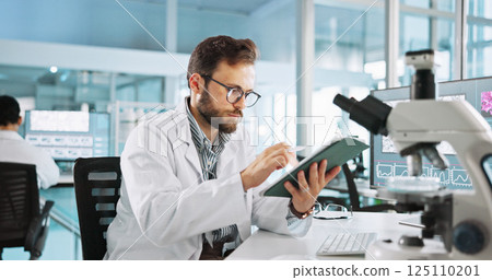 Scientist, man and tablet for study at laboratory with feedback, review and medical notes for pharma job. Person, typing and equipment with application for vaccine, development and clinical trial 125110201