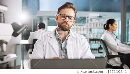 Reading, laptop and science with man in laboratory for clinical trail, online and research. Medical journal report, review and pharmacy drug development with person for healthcare and biotechnology Reading, laptop and science with man in laboratory for clinical trail, online and research. Medical journal report, review and pharmacy drug development with person for healthcare and biotechnology 125110241