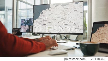 Computer screen, hands and wind turbine with business person in office for renewable energy or sustainability. Electricity, typing and windmill with map on display for development or engineering 125110366