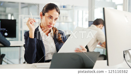 Laptop, review or businesswoman with paperwork for research, financial news or profit evaluation. Budget, finance advisor or economist reading documents for revenue growth, payroll and technology 125110382