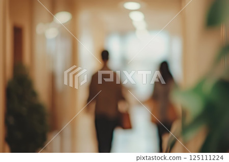 Blurred background people walking along corridor in office. mocha mousse coloured realistic photo 125111224