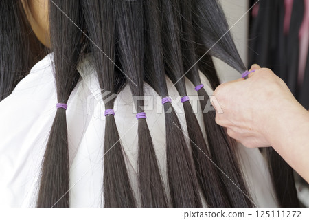 Hair tied up for hair donation 125111272