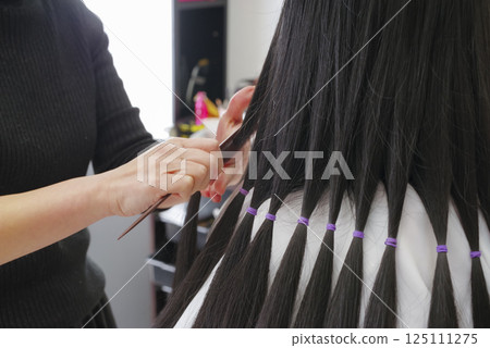 Hair tied up for hair donation 125111275