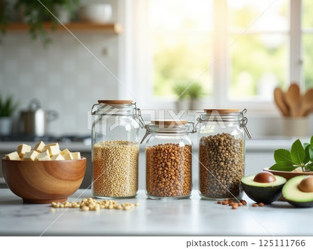 glass jars filled with different plant-based protein sources - quinoa, lentils, almonds. glass jars filled with different plant-based protein sources - quinoa, lentils, almonds. 125111766