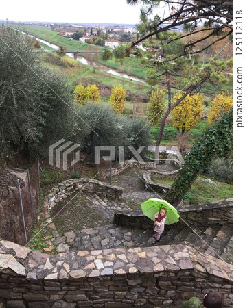 Child with Green Umbrella on Stone Staircase 125112118