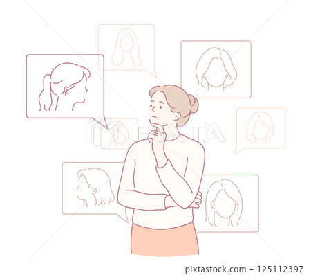 A contemplative woman is deeply engaged in analyzing and considering various hairstyles and styles 125112397