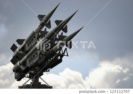 Four missiles on a launcher - 3D illustration 125112707