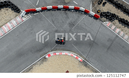 Aerial view go kart racer race curve circuit, Go kart at circuit curve, Top view race go kart track curve. 125112747