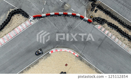 Aerial view go kart racer race curve circuit, Go kart at circuit curve, Top view race go kart track curve. Aerial view go kart racer race curve circuit, Go kart at circuit curve, Top view race go kart track curve. 125112854