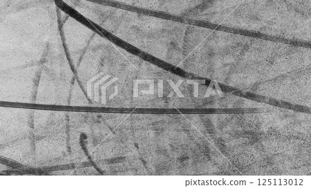 Car tire mark from car skid mark, Car tire on asphalt road race track, Texture and background car wheel tire mark on asphalt road. 125113012