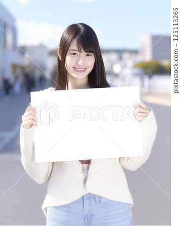 Female student holding a message board (AI-generated image) 125113265