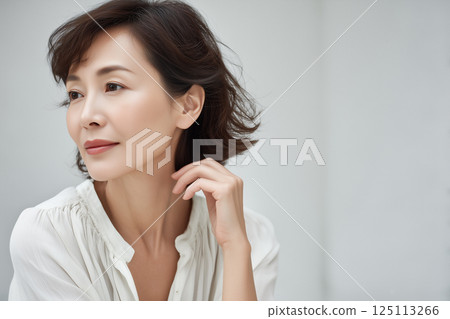 Natural looking Japanese senior woman (AI generated image) 125113266