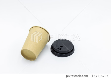 Brown paper coffee cup with black lid on white background, Brown paper cup blank coffee cup for takeaway on white background, Brown empty paper cup for coffee eco coffee cafe. Brown paper coffee cup with black lid on white background, Brown paper cup blank coffee cup for takeaway on white background, Brown empty paper cup for coffee eco coffee cafe. 125113293