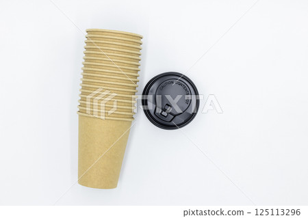 Brown paper coffee cup with black lid on white background, Brown paper cup blank coffee cup for takeaway on white background, Brown empty paper cup for coffee eco coffee cafe. Brown paper coffee cup with black lid on white background, Brown paper cup blank coffee cup for takeaway on white background, Brown empty paper cup for coffee eco coffee cafe. 125113296