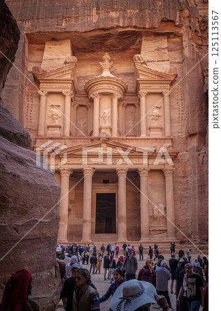 Tourists walking towards al khazneh, the treasury, in the ancient city of petra, jordan, a unesco world heritage site Tourists walking towards al khazneh, the treasury, in the ancient city of petra, jordan, a unesco world heritage site 125113567