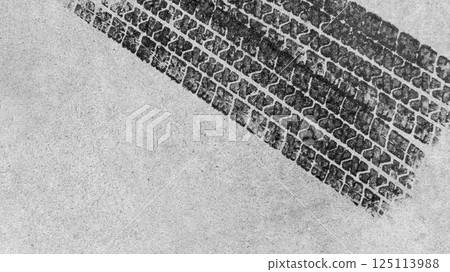 Top view tire marks on the asphalt road, Abstract texture and background black tire tracks on asphalt road, Tire marks on race track texture and background, Vehicle trace on road tire print texture of 125113988
