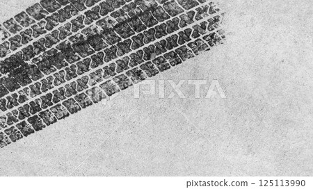 Black tire marks on road, Black rubber tire marks and tread marks, Tire trace track wheels texture and background, Auto tire tread grunge, Car wheel tyre tread track black tyre print, Top view. 125113990