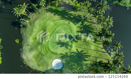 Top view golf course with lush greens, green fairway and sand bunker, Golf course green grass and trees fairway and putting green, Beautiful golf course. 125114269