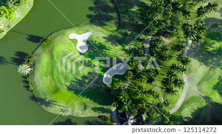 Top view golf course with lush greens, green fairway and sand bunker, Golf course green grass and trees fairway and putting green, Beautiful golf course. 125114272
