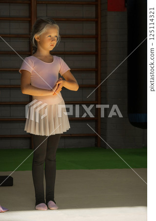 Training of children in the gym. Gymnastics, circus, fitness for girls. High quality photo 125114321