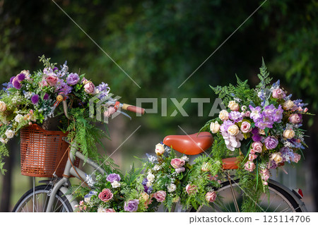 Bicycle decorated with flowers, Old bicycle with flowers street garden decoaration, Vintage retro bicycle decorated with flowers. 125114706
