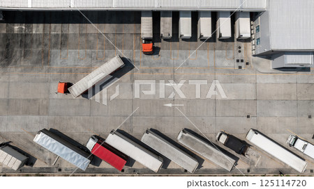 Top view semi truck with cargo trailer at logistic park warehouse load unload goods, Distribution warehouse shipping supply chain, Business transportation logistic freight shipping cargo by semi truck Top view semi truck with cargo trailer at logistic park warehouse load unload goods, Distribution warehouse shipping supply chain, Business transportation logistic freight shipping cargo by semi truck 125114720