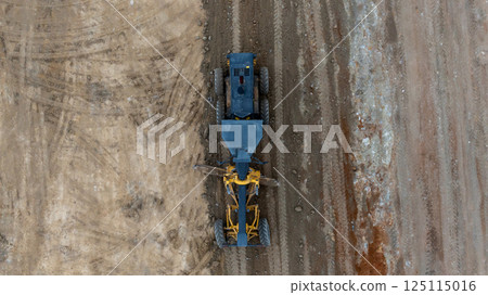 Aerial view motor grader civil at construction site, Motor grader work on construction site, Road grader on road construction site machine work on the construction of new road. 125115016
