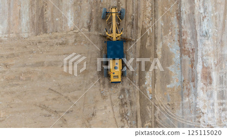 Aerial view motor grader civil at construction site, Motor grader work on construction site, Road grader on road construction site machine work on the construction of new road. Aerial view motor grader civil at construction site, Motor grader work on construction site, Road grader on road construction site machine work on the construction of new road. 125115020